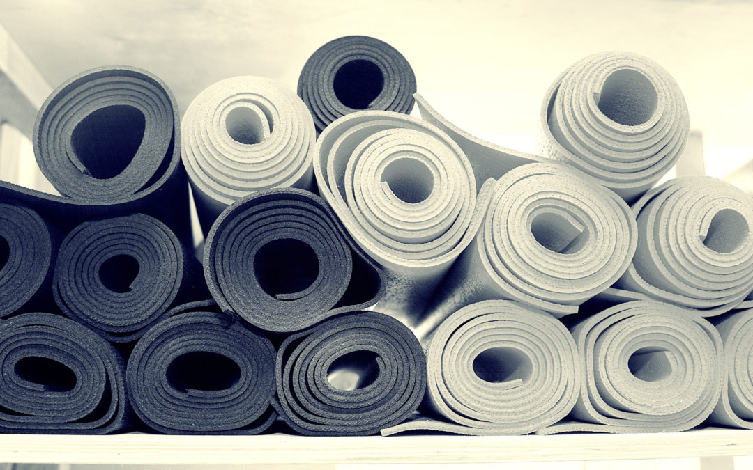 A stack of rolled up yoga mats